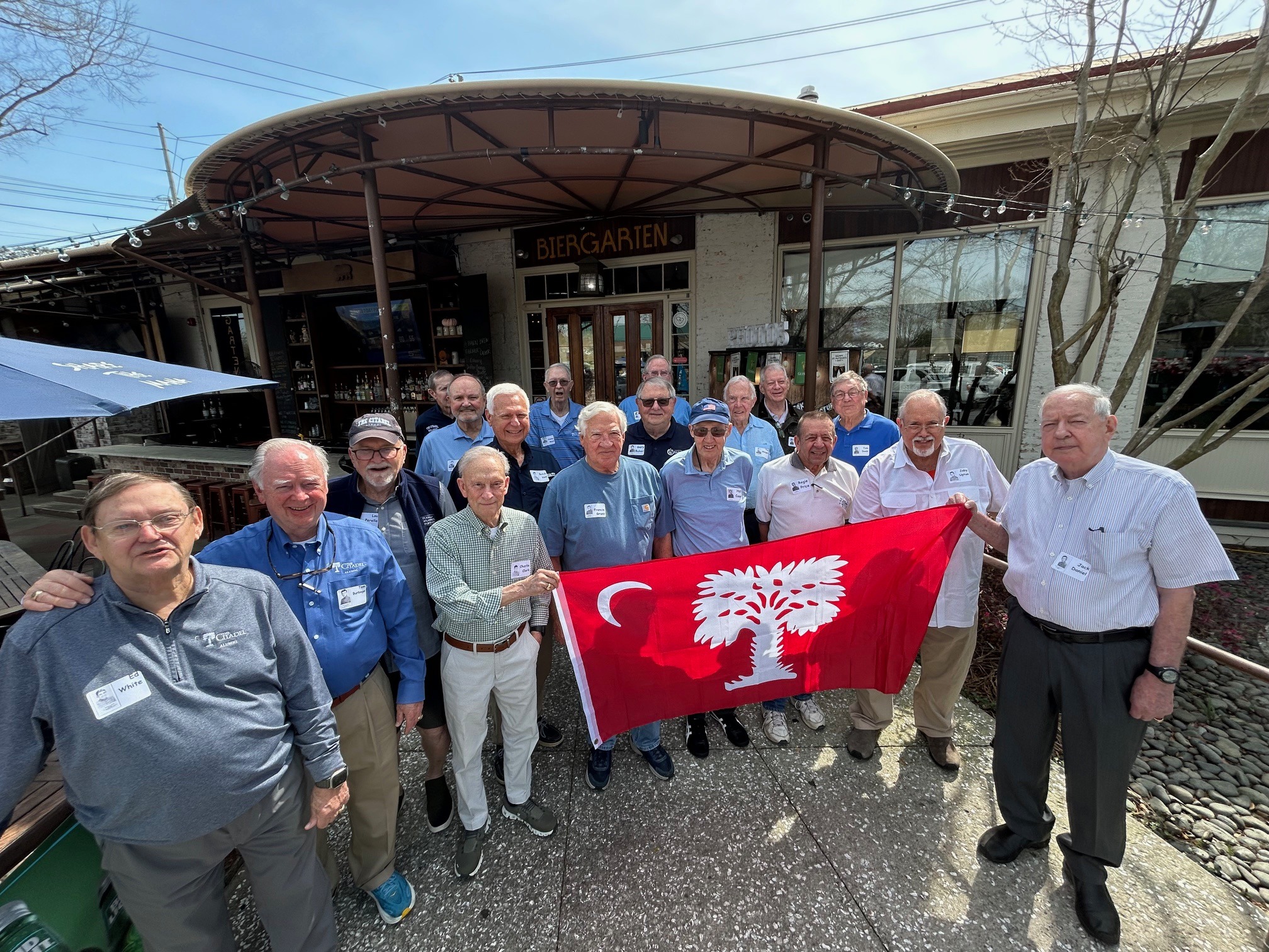 On March 11 members of the Class of 1966 gathered at the Bay Street Biergarten for their 43rd consecutive monthly noon formation, honoring the lives of eight classmates who passed away since March 2025. Attending were (front row, left to right) Ed White; Tom Burbage; Charlie Clark; Francis Grant; Hal Coar; Regie Price; Joby Upton; Jack Daniel; (second row) Lou Perella; Butch Volf; Gary Baker; Tim Slaight; Tom Dodd; (back row) Horace Canady; Jimmy Benton; Jimmy Reed; Frank Freeman; and Harry Jones. Ed Grimball attended but is not pictured. This fall, ’66 will return to The Citadel to celebrate its 60th reunion on campus.